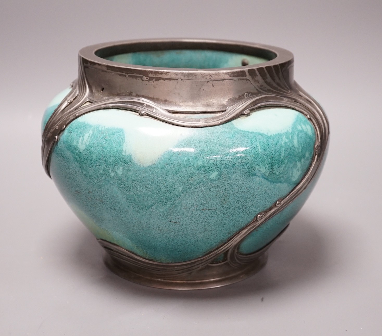 An Art Nouveau Orvit pewter mounted Ruskin style turquoise glazed jardiniere, 18cms high